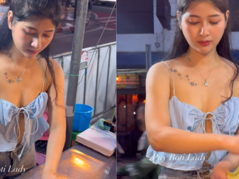 Thai Girl Sail Parathha-The-Girl-Is-Selling-Parathas-On-The-Roadside-In-A-Modern-Style-There-Is-A-Long-Line-Of-Customers-Know-Where-She-Sets-Up-Her-Cart