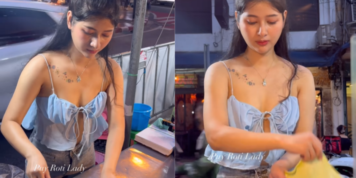 Thai Girl Sail Parathha-The-Girl-Is-Selling-Parathas-On-The-Roadside-In-A-Modern-Style-There-Is-A-Long-Line-Of-Customers-Know-Where-She-Sets-Up-Her-Cart